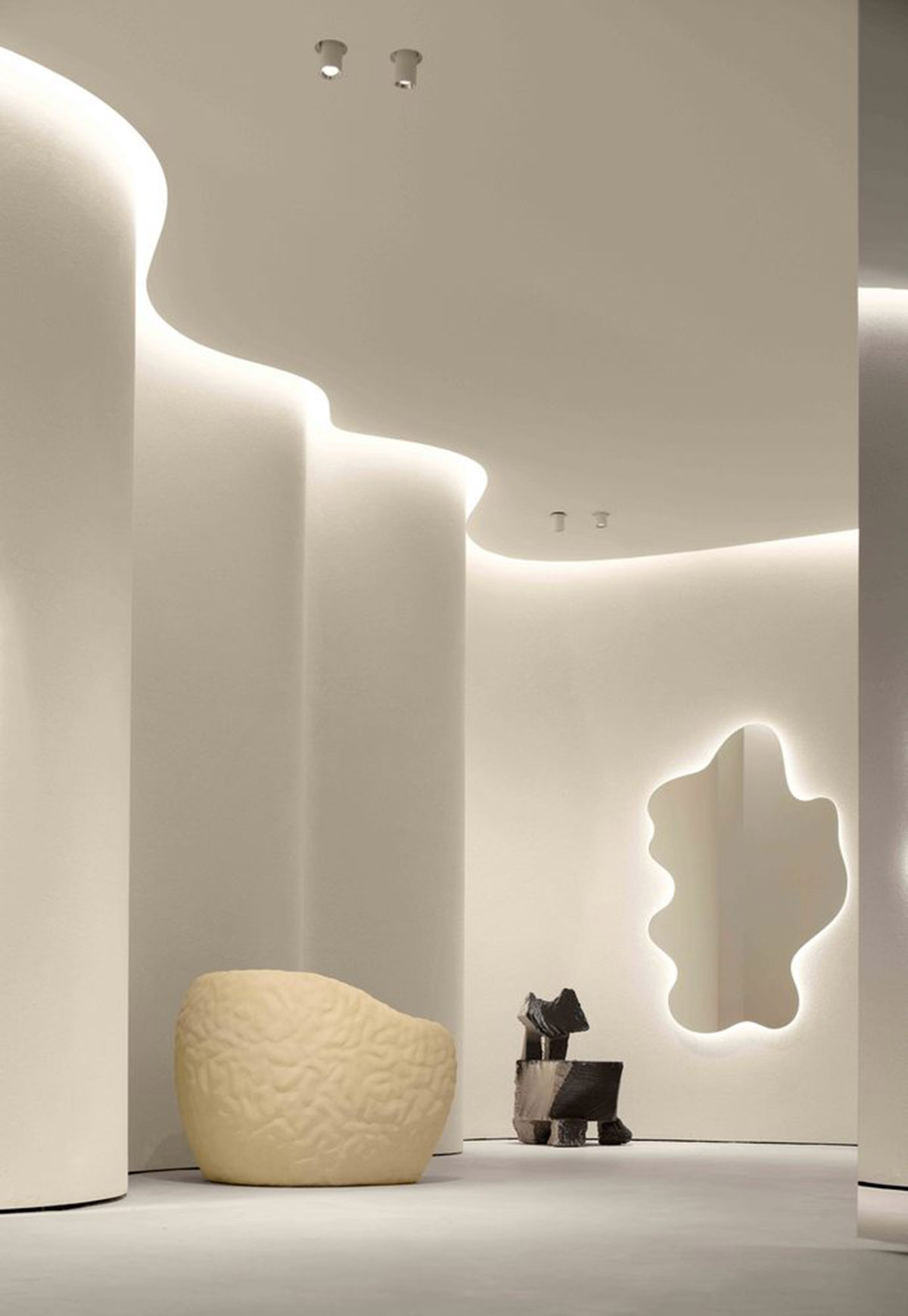 F.O.G. Architecture creates cave-like interiors with mirrored surfaces for aromatherapy store