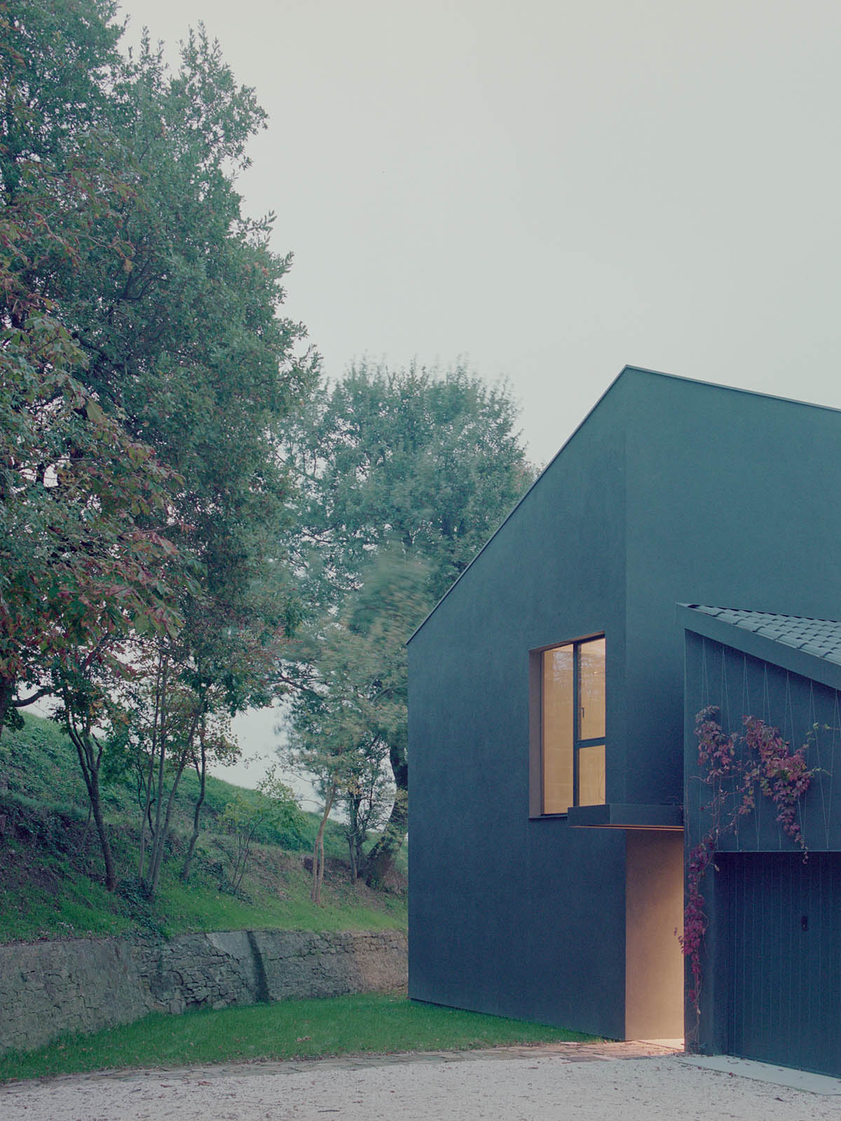 LADO architetti transforms 1970s house into a clean, monochromatic volume in Italy