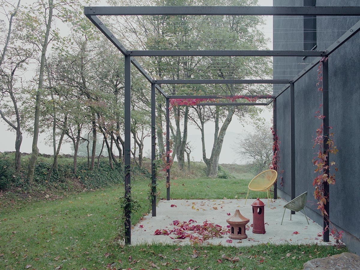 LADO architetti transforms 1970s house into a clean, monochromatic volume in Italy