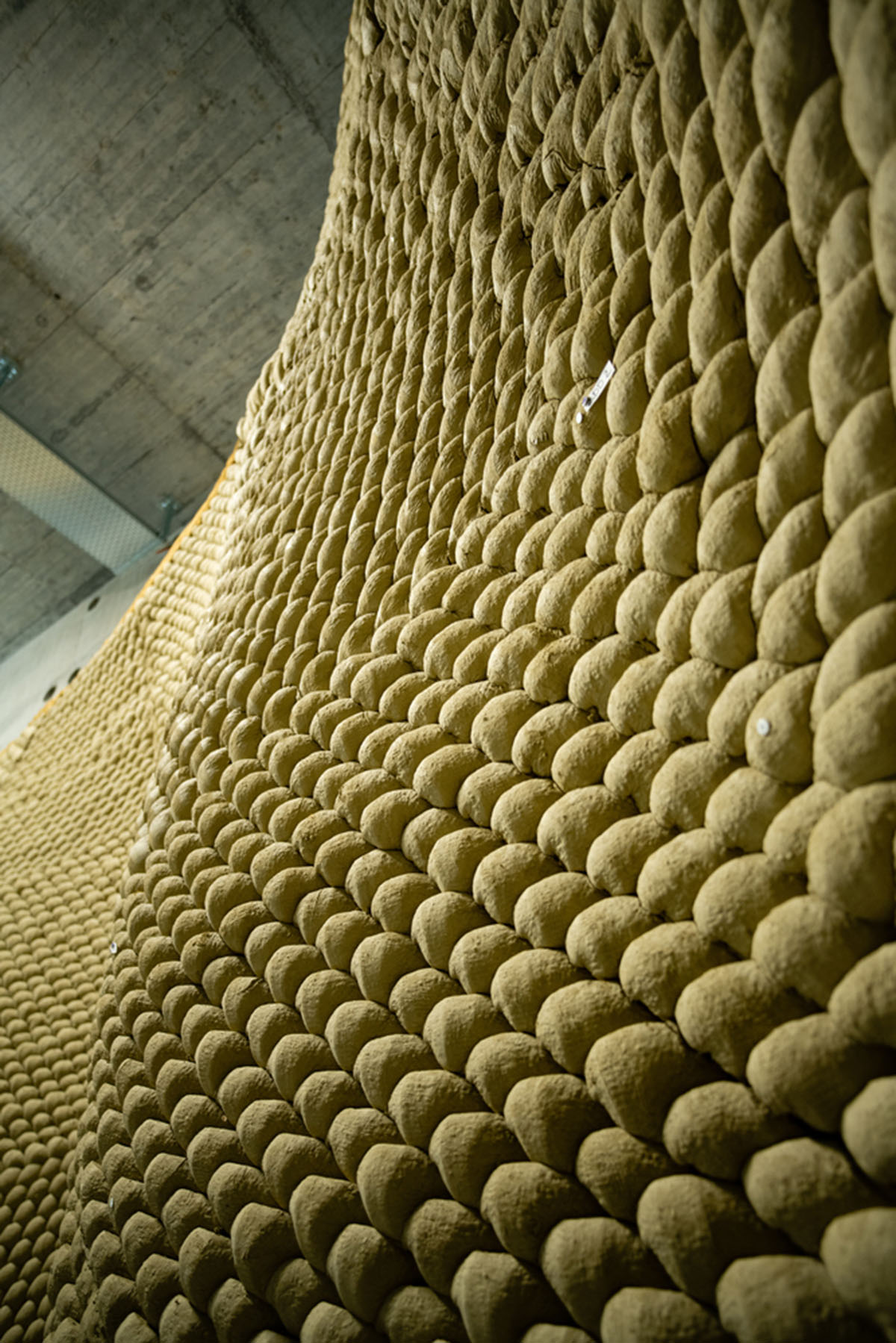 Gramazio Kohler Research used 30,000 soft clay bricks to install undulating clay rotunda in Bern