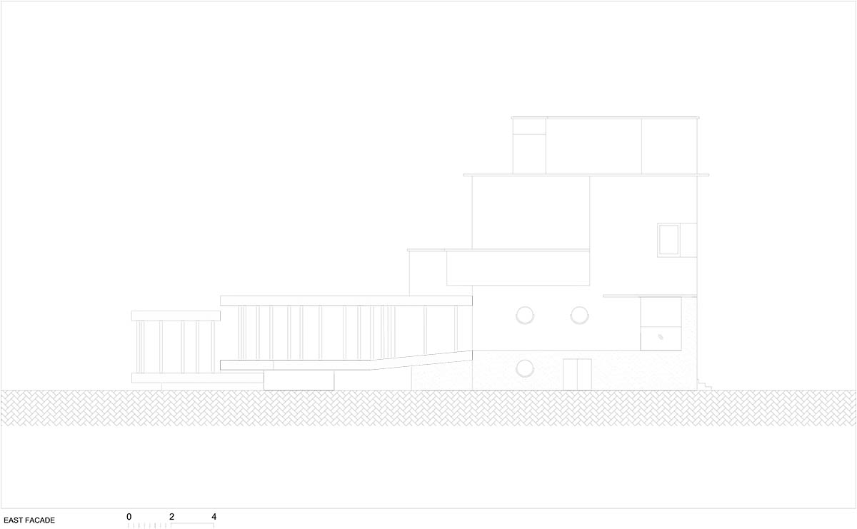 OFIS Architects renovates 1930s house with colonnaded and sloped pavilion in Slovenia 