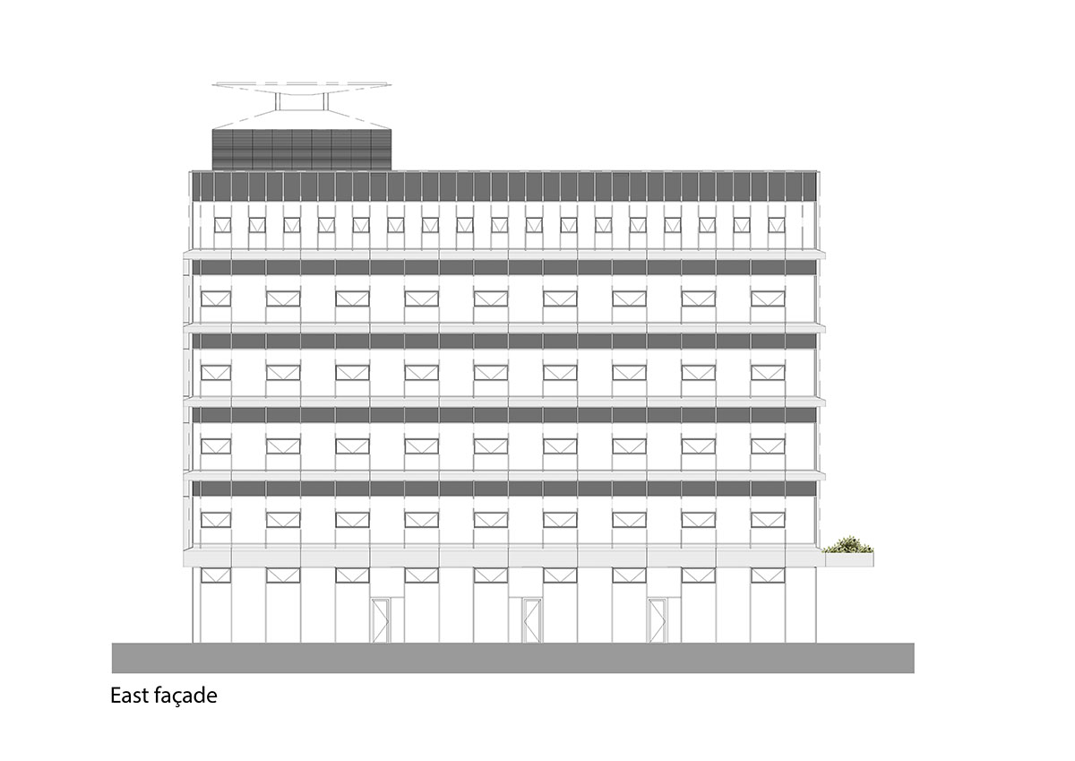Untreated tree trunks pass through the central staircase of the Langeveld Building in Rotterdam