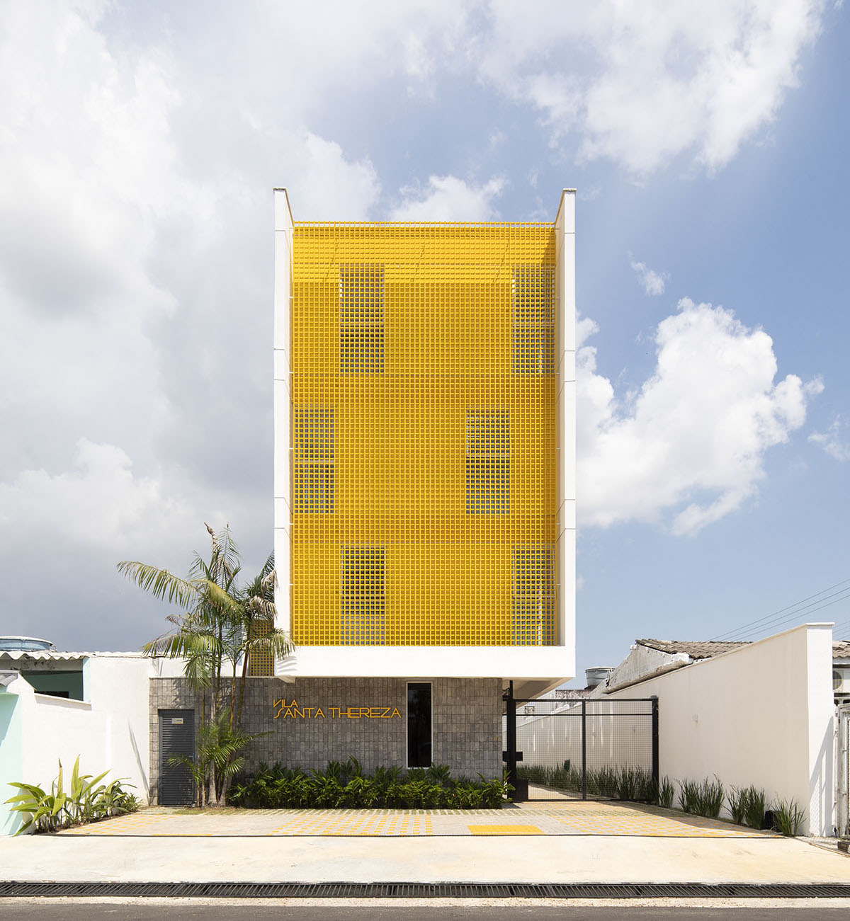 Manga - Vila Santa Thereza Building by Laurent Troost features yellow metal screen in Brazil