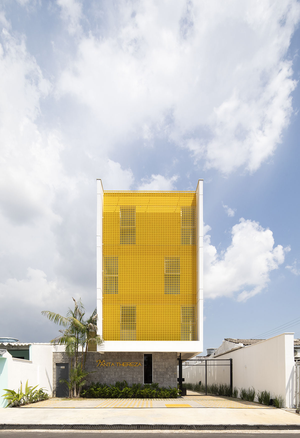 Manga - Vila Santa Thereza Building by Laurent Troost features yellow metal screen in Brazil