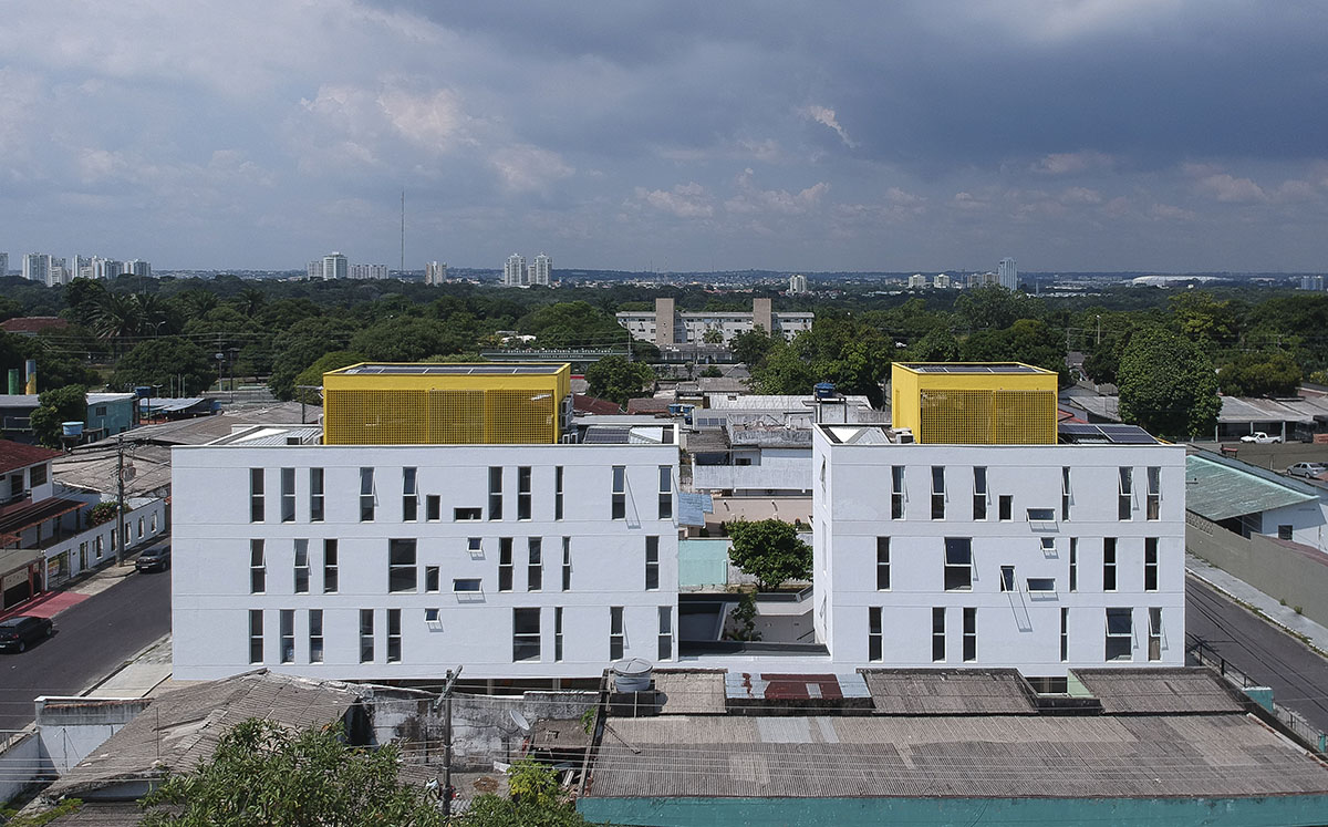 Manga - Vila Santa Thereza Building by Laurent Troost features yellow metal screen in Brazil
