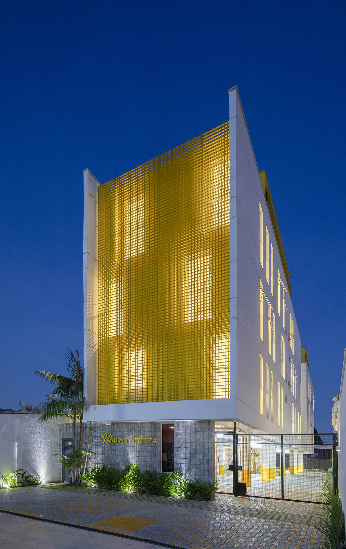 Manga - Vila Santa Thereza Building by Laurent Troost features yellow metal screen in Brazil