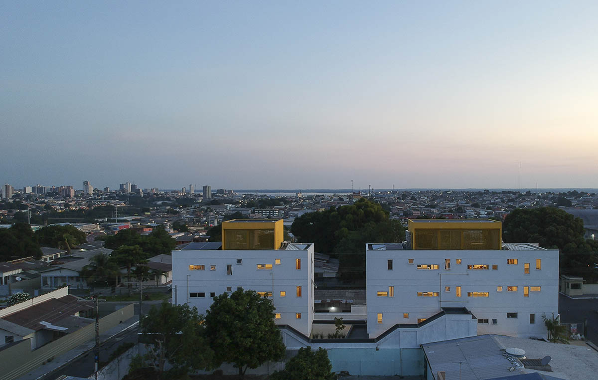 Manga - Vila Santa Thereza Building by Laurent Troost features yellow metal screen in Brazil