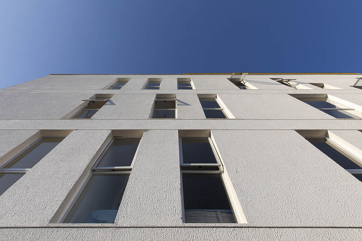 Manga - Vila Santa Thereza Building by Laurent Troost features yellow metal screen in Brazil