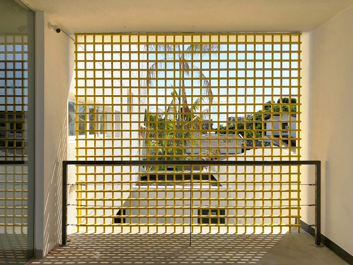 Manga - Vila Santa Thereza Building by Laurent Troost features yellow metal screen in Brazil