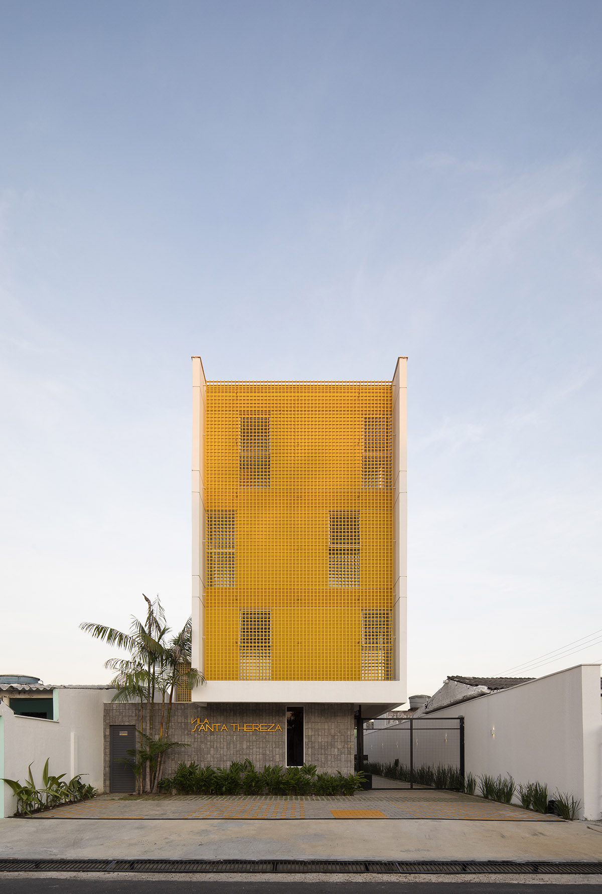 Manga - Vila Santa Thereza Building by Laurent Troost features yellow metal screen in Brazil