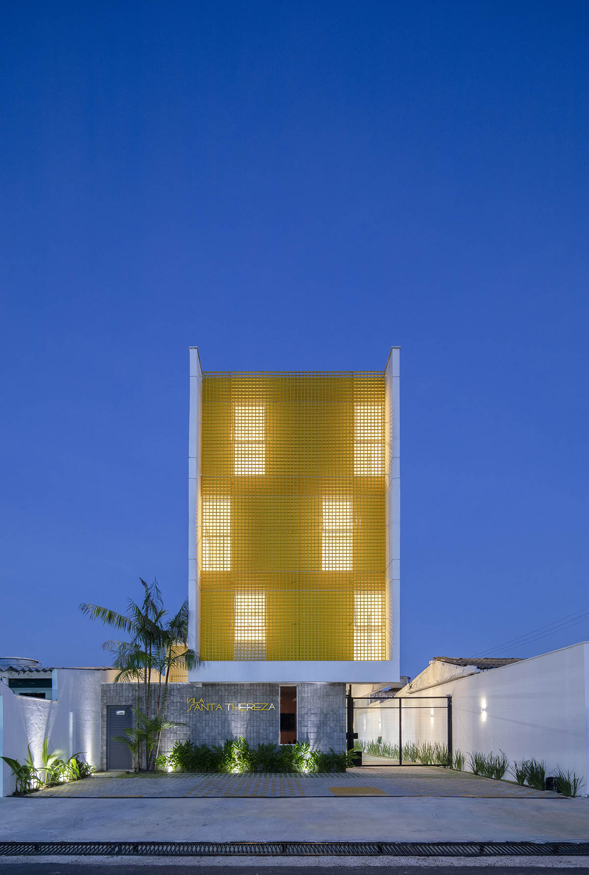 Manga - Vila Santa Thereza Building by Laurent Troost features yellow metal screen in Brazil
