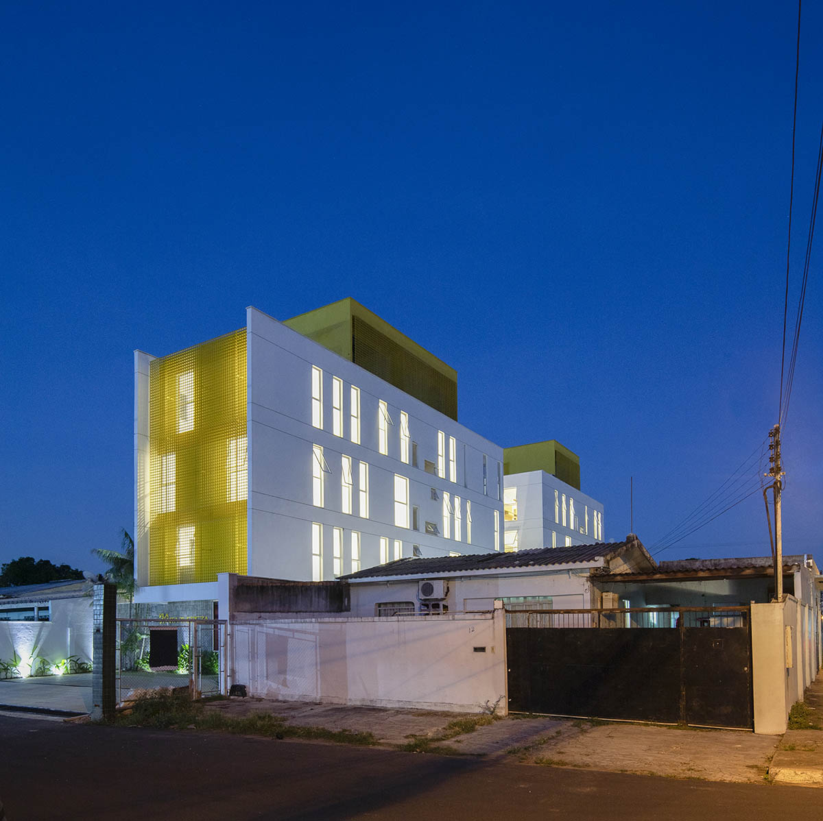 Manga - Vila Santa Thereza Building by Laurent Troost features yellow metal screen in Brazil