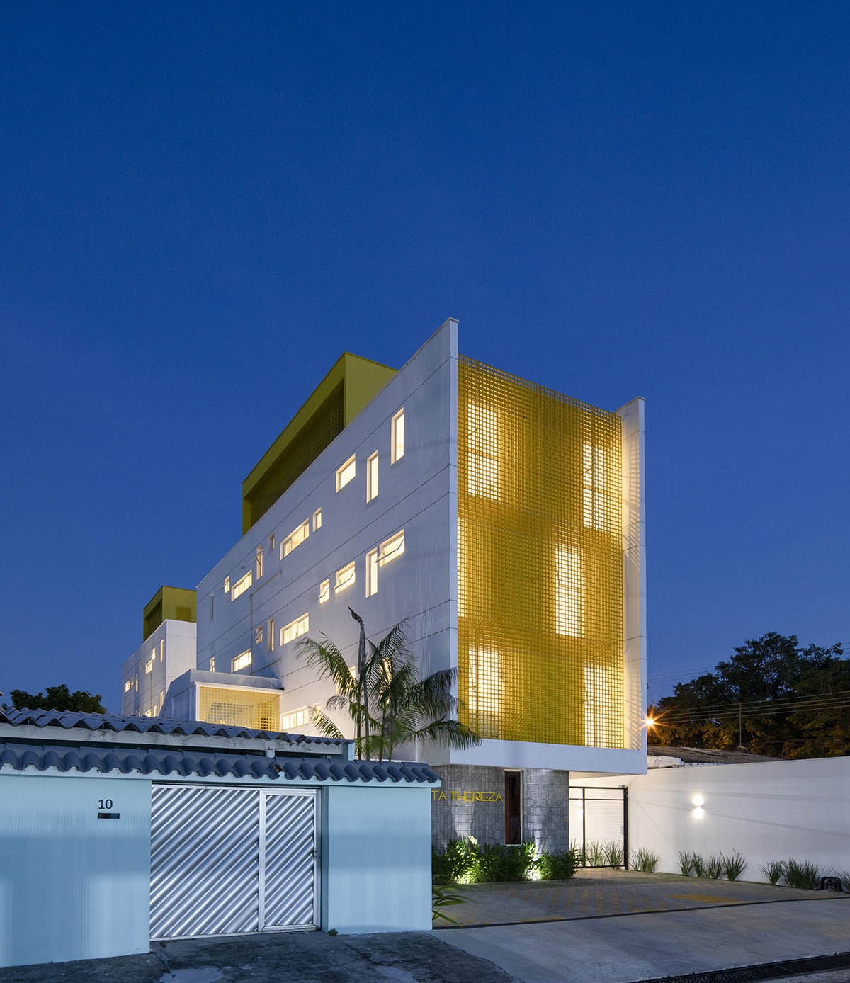 Manga - Vila Santa Thereza Building by Laurent Troost features yellow metal screen in Brazil