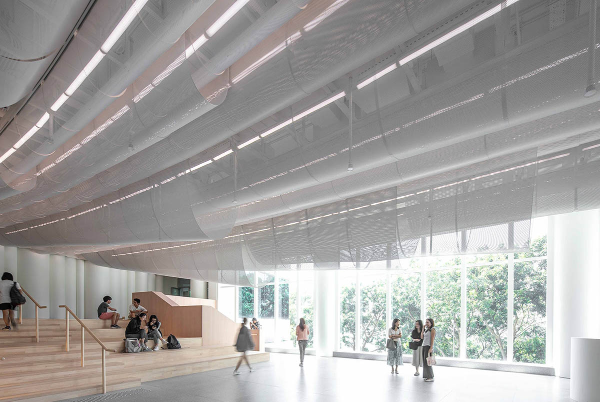 Atelier Nuno Architects suspends tubular aluminum panels from the ceiling of a lobby in Hong Kong