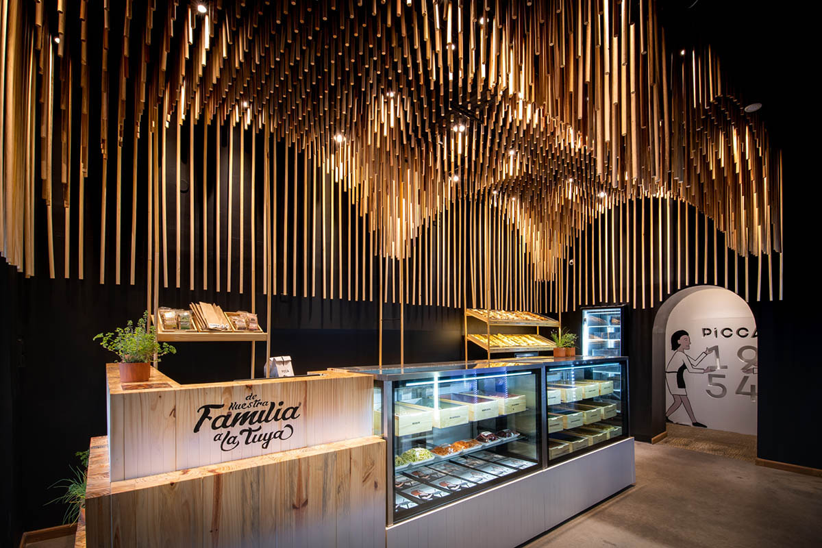Efeeme arquitectos suspends thousands of broomsticks from the ceiling of patisserie in C&oacute;rdoba