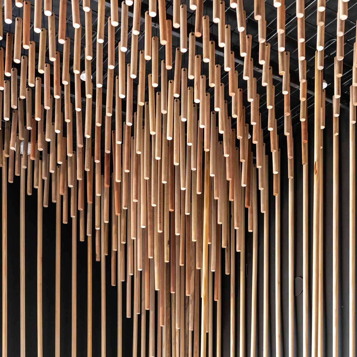 Efeeme arquitectos suspends thousands of broomsticks from the ceiling of patisserie in C&oacute;rdoba