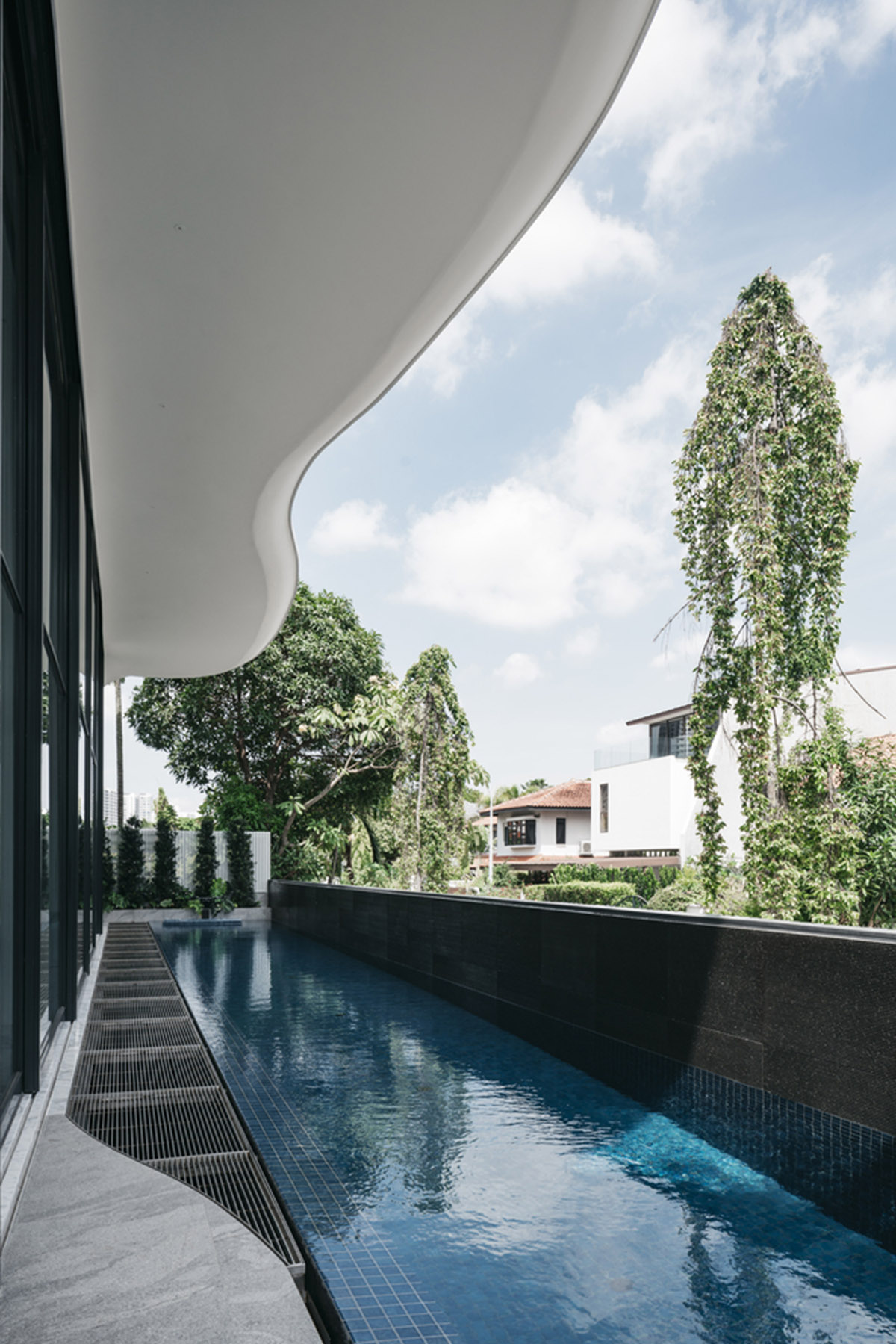 EHKA Studio's curvaceous residence features floating pods offering playful facade in Singapore