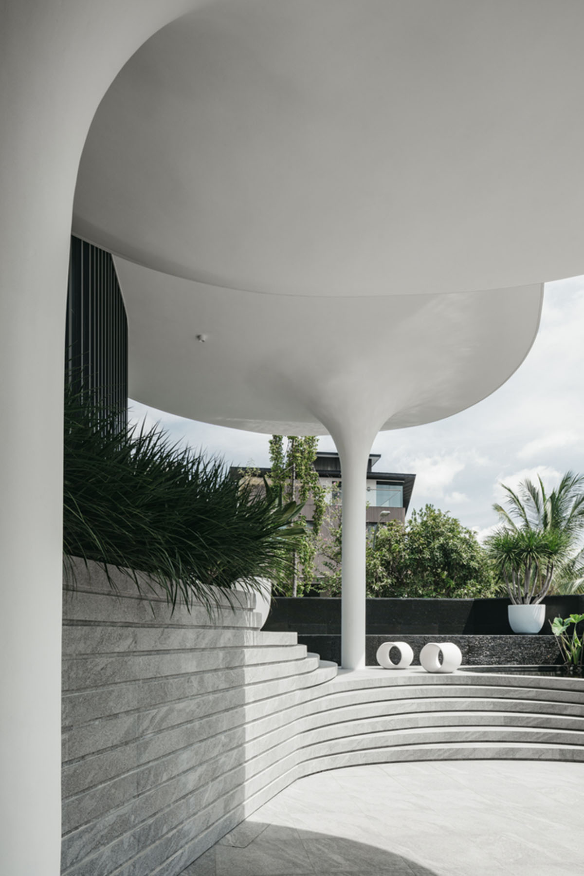 EHKA Studio's curvaceous residence features floating pods offering playful facade in Singapore