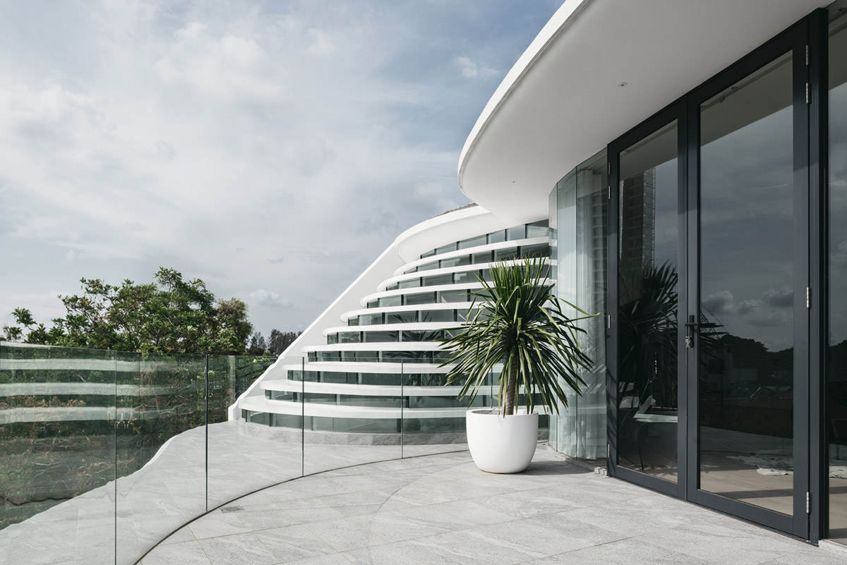 EHKA Studio's curvaceous residence features floating pods offering playful facade in Singapore