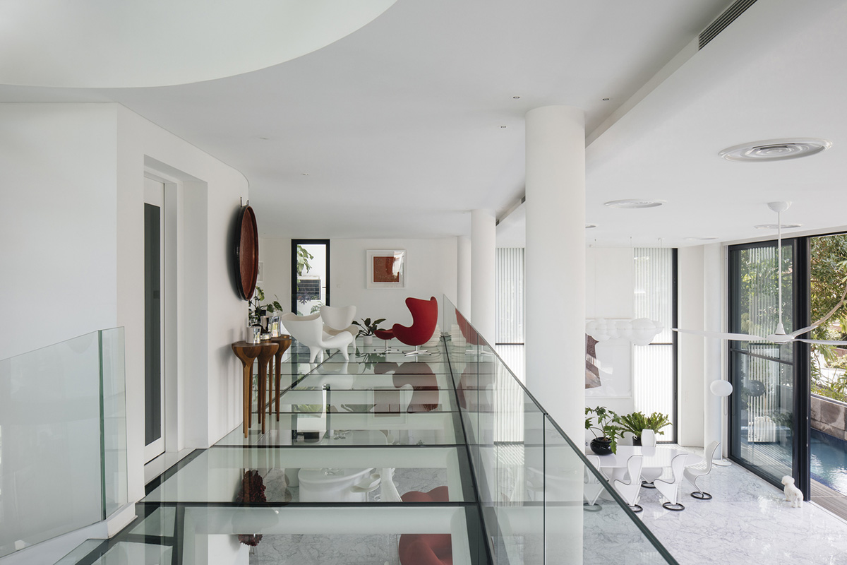 EHKA Studio's curvaceous residence features floating pods offering playful facade in Singapore