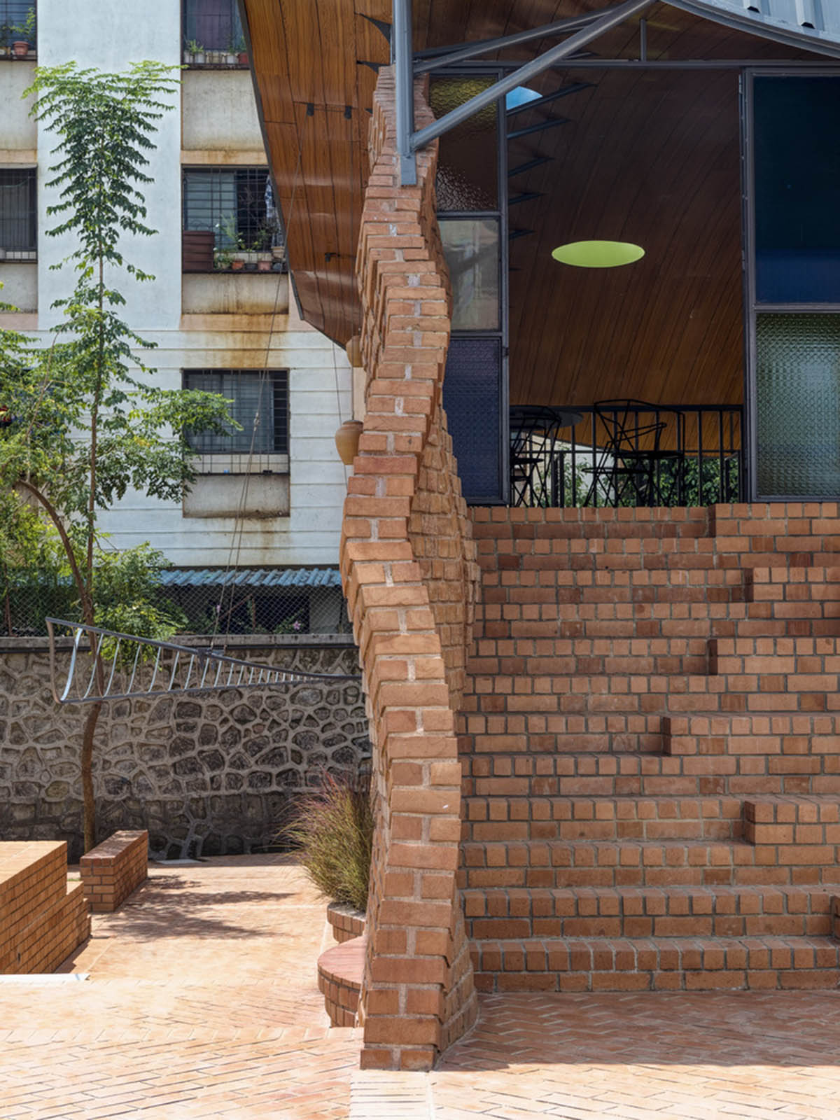 PMA madhushala's community center features undulating and artistic brick walls in Pune