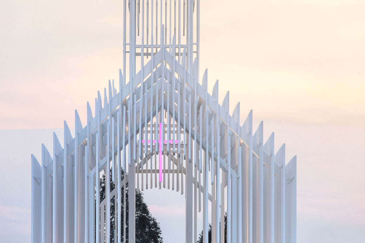 A church made of thousands of white thin beams looks like suspended in the air in lavender field