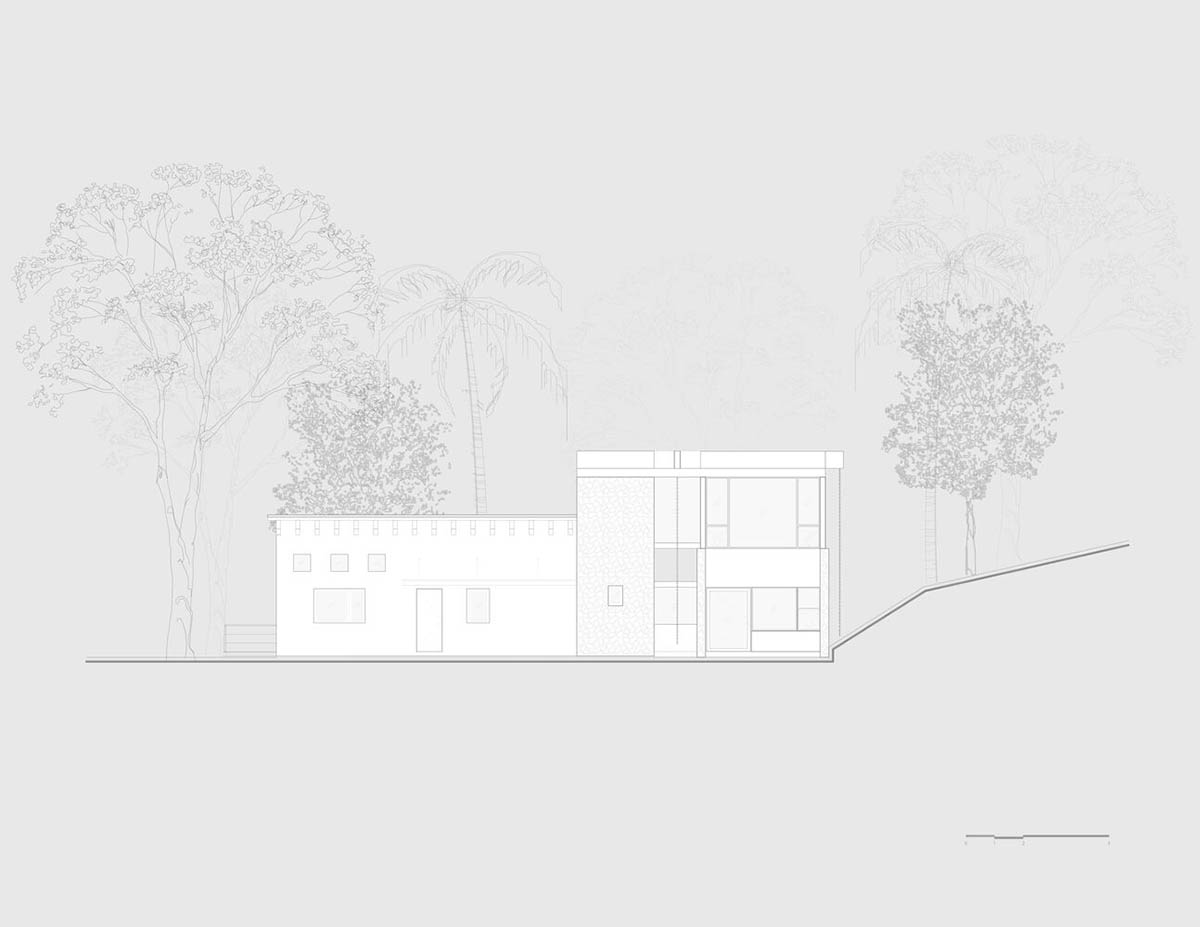 Luis Carbonell extends existing stone house with pastel-toned textured volume in a Mexican valley 