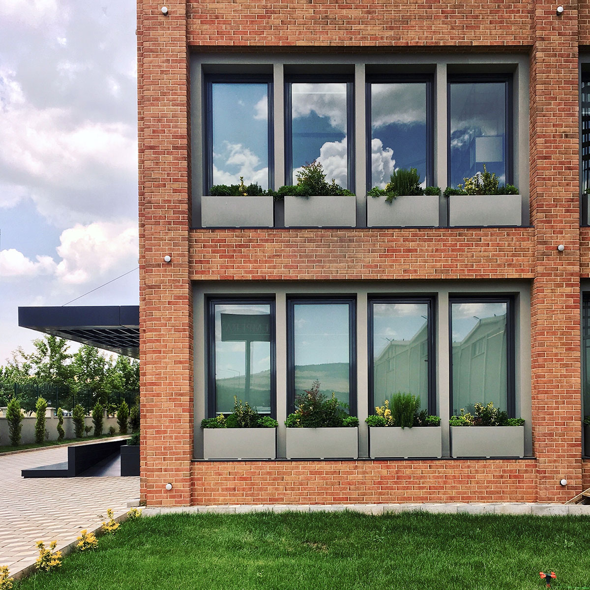 Yerce Architecture and ZAAS complete Empera Headquarters with large brick openings in Gaziantep