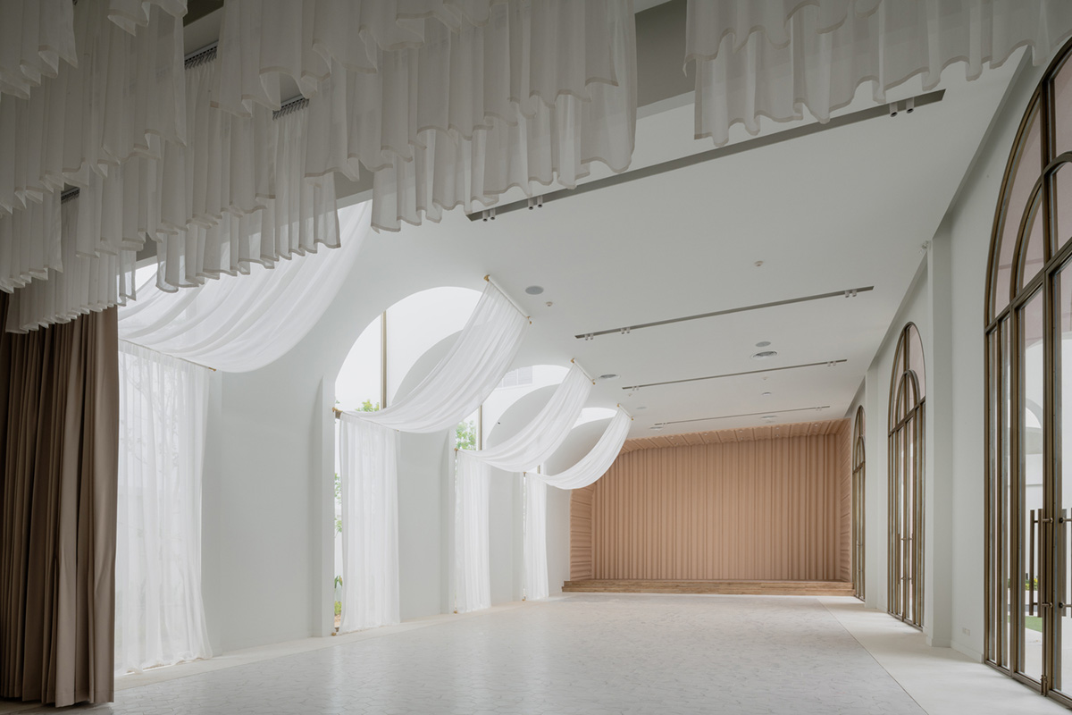 PHTAA creates flexible wedding venue with half-arch modular elements and white curved walls