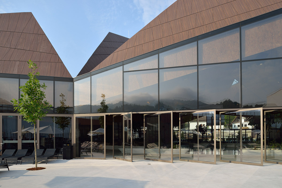 ENOTA's new spa complex made of tetrahedral volumes is spread as part of existing rural buildings