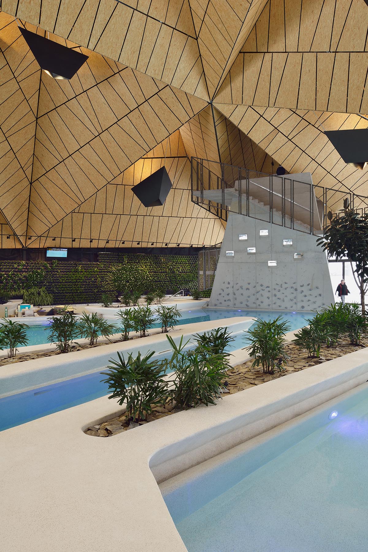 ENOTA's new spa complex made of tetrahedral volumes is spread as part of existing rural buildings