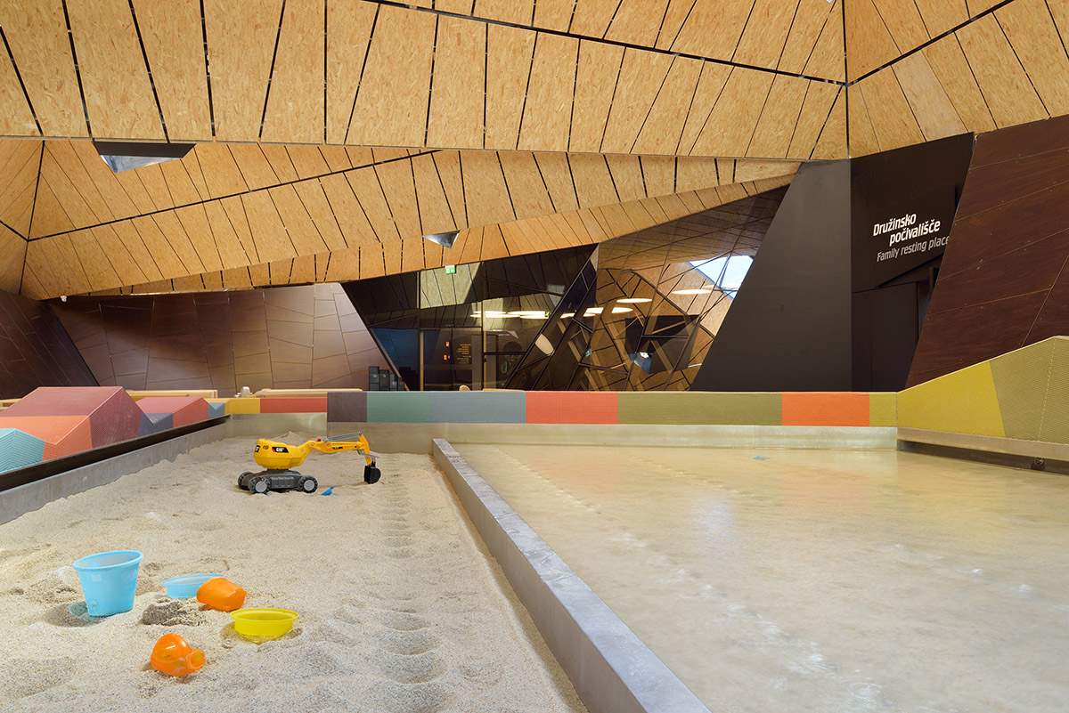 ENOTA's new spa complex made of tetrahedral volumes is spread as part of existing rural buildings