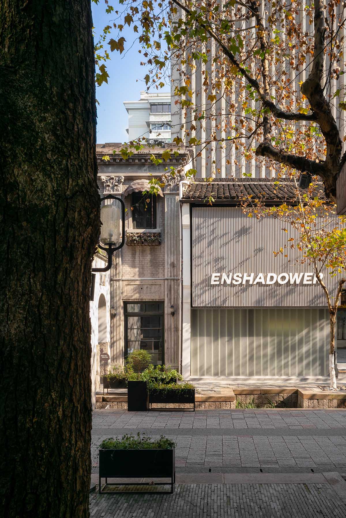 say architects reinterprets ten decades old building as a new store in Hangzhou