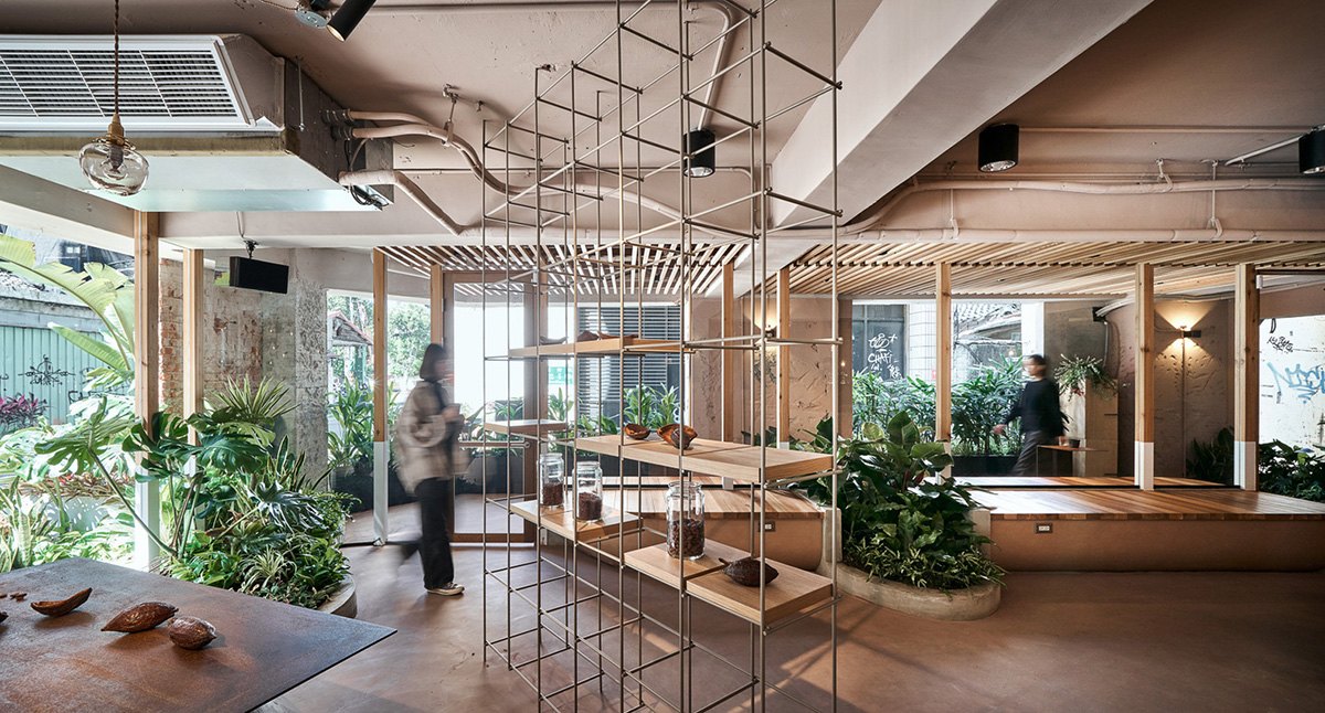 Soar Design Studio adds greenery and smooth surfaces to chocolate store offering garden-like space