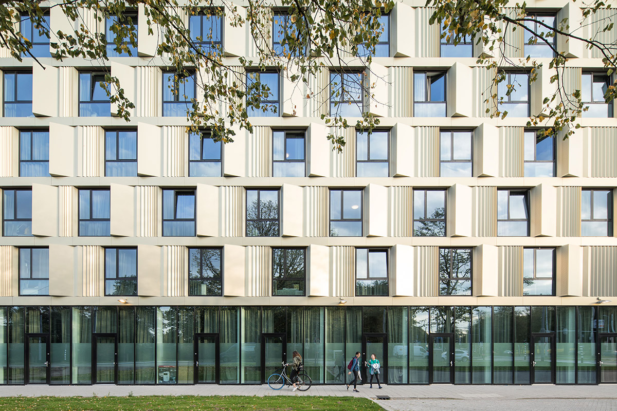 Mecanoo completes cubic student housing wrapped in gold-tinted fa&ccedil;ade in Rotterdam