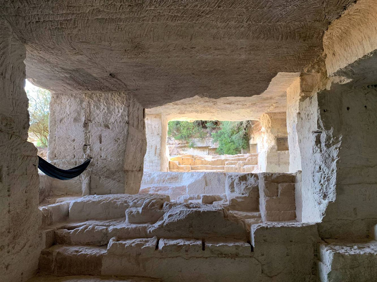 Ensamble Studio carves out former military sandstone quarry to design Ca'n Terra House in Menorca