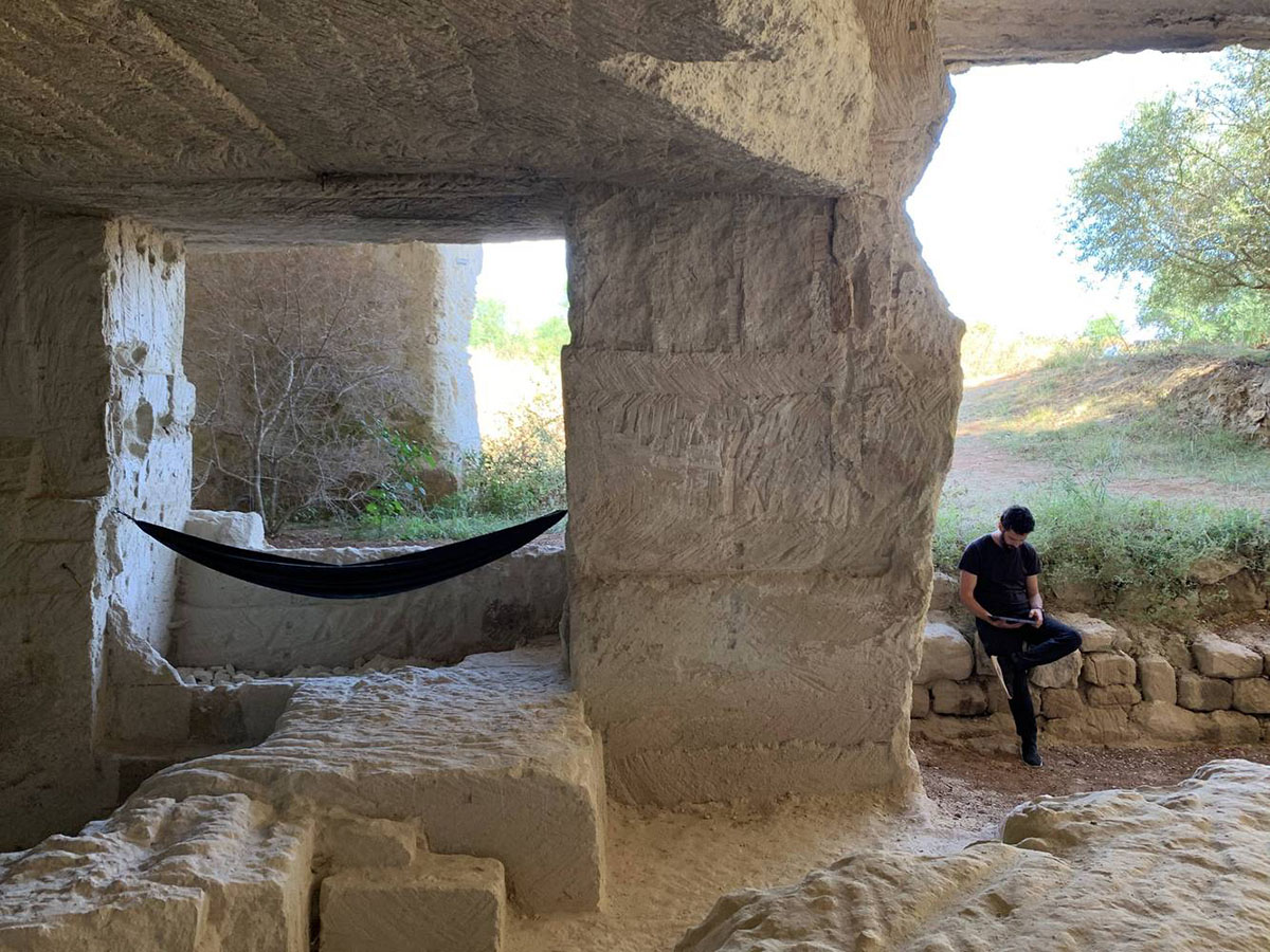 Ensamble Studio carves out former military sandstone quarry to design Ca'n Terra House in Menorca