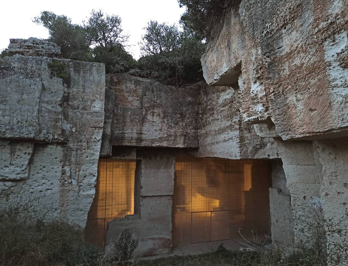 Ensamble Studio carves out former military sandstone quarry to design Ca'n Terra House in Menorca