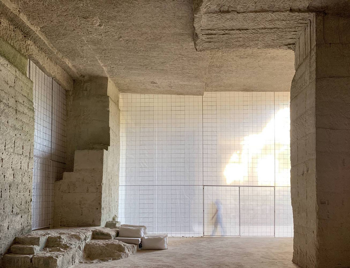 Ensamble Studio carves out former military sandstone quarry to design Ca'n Terra House in Menorca