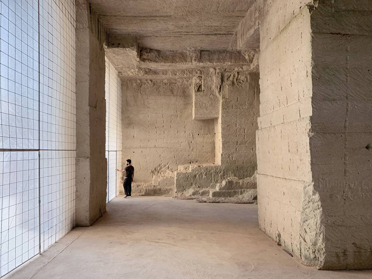 Ensamble Studio carves out former military sandstone quarry to design Ca'n Terra House in Menorca