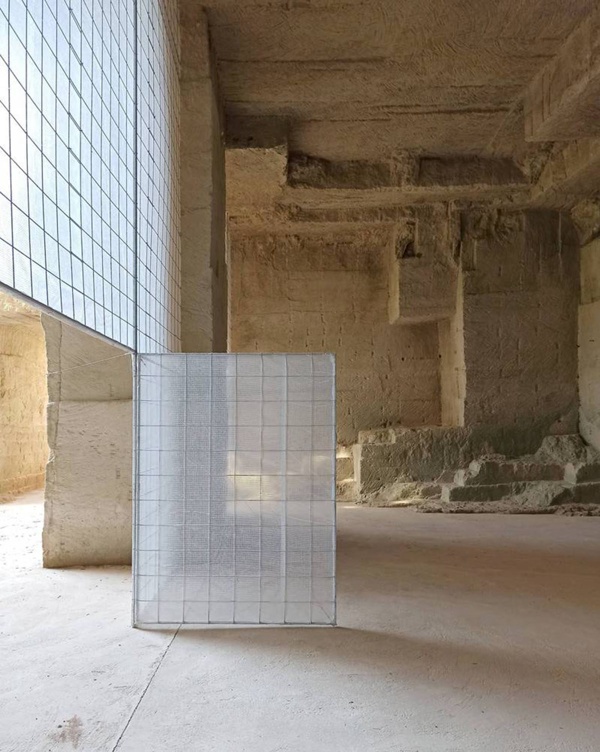 Ensamble Studio carves out former military sandstone quarry to design Ca'n Terra House in Menorca