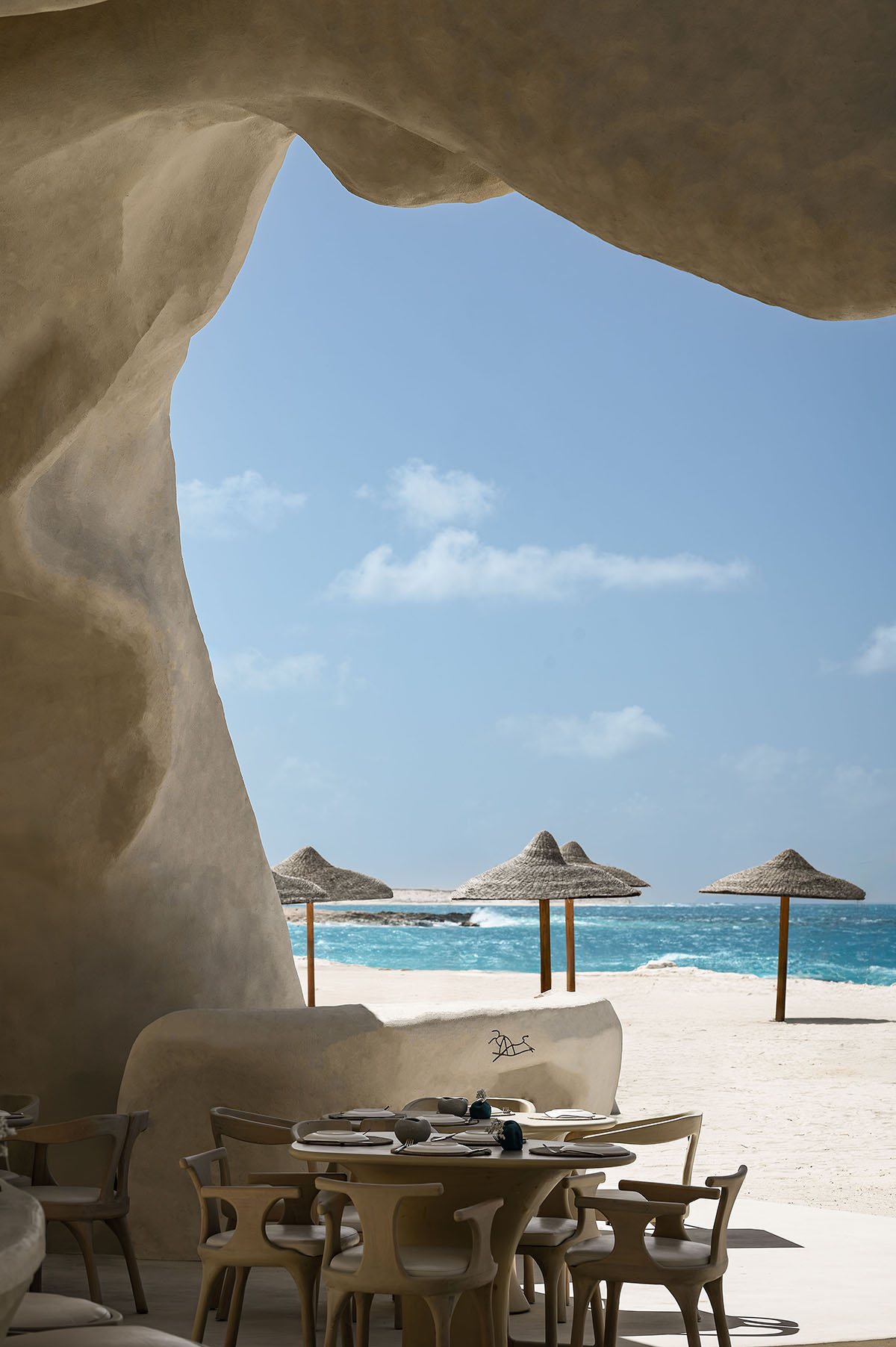 Badie Architects imagines Esca Playa restaurant as a continuous concrete shell in a desert 