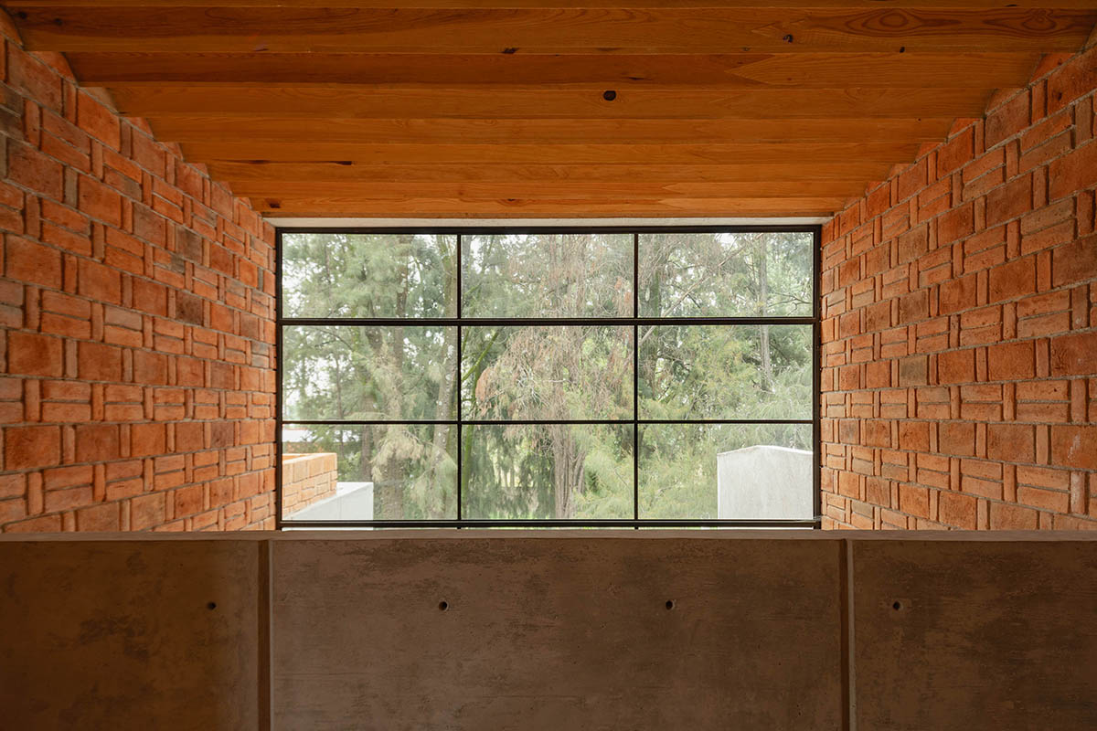 Estudio Tecalli uses red clay brick, concrete and glass to form MoMa House in Mexico