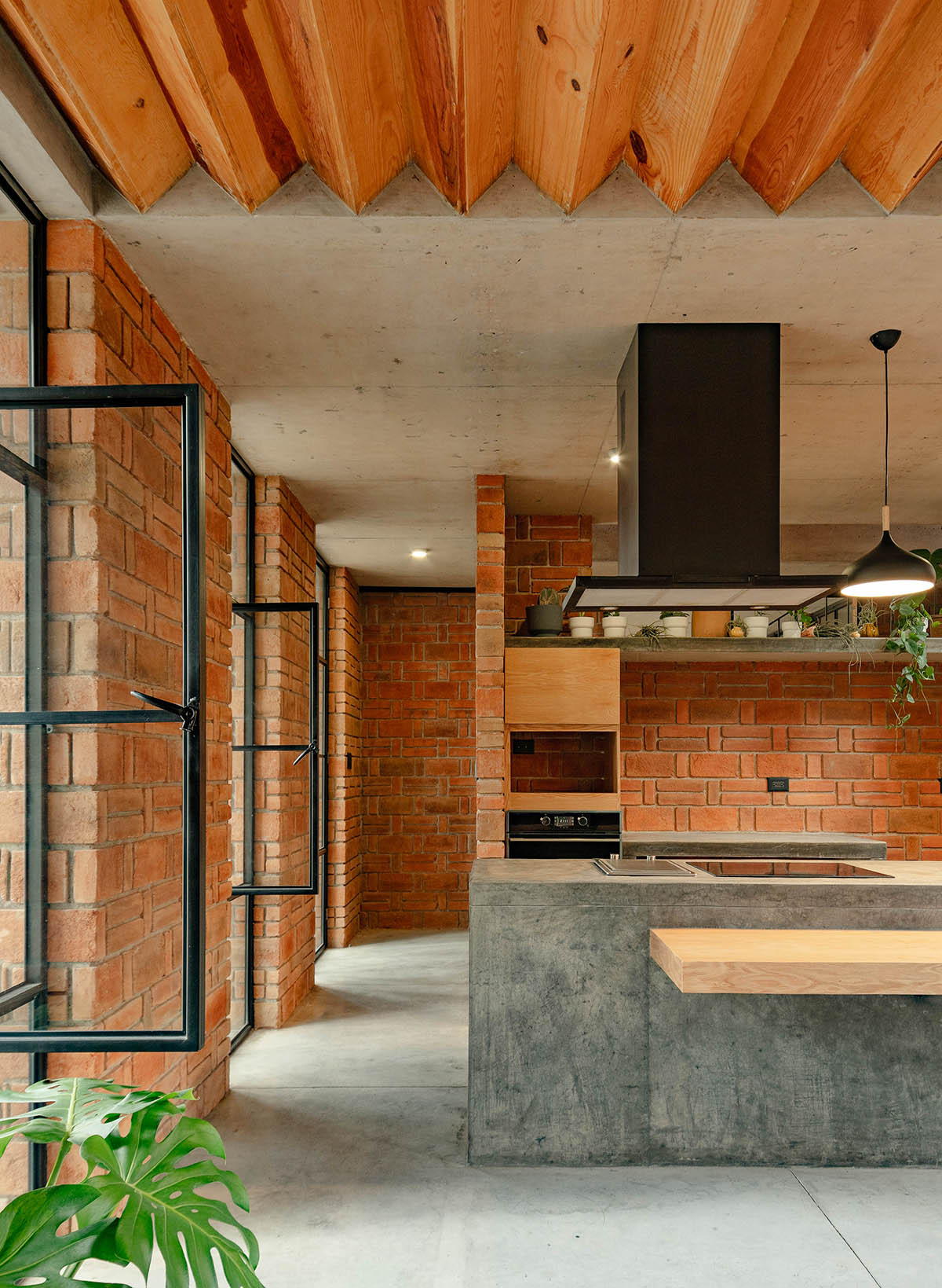 Estudio Tecalli uses red clay brick, concrete and glass to form MoMa House in Mexico