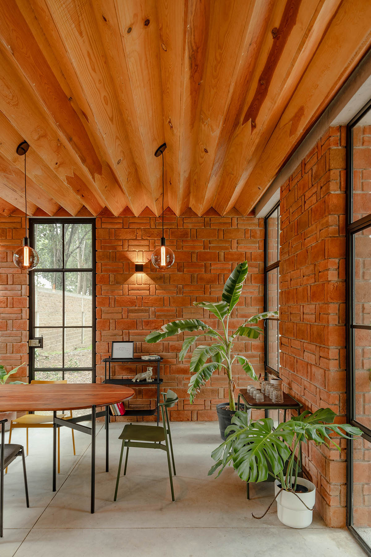 Estudio Tecalli uses red clay brick, concrete and glass to form MoMa House in Mexico