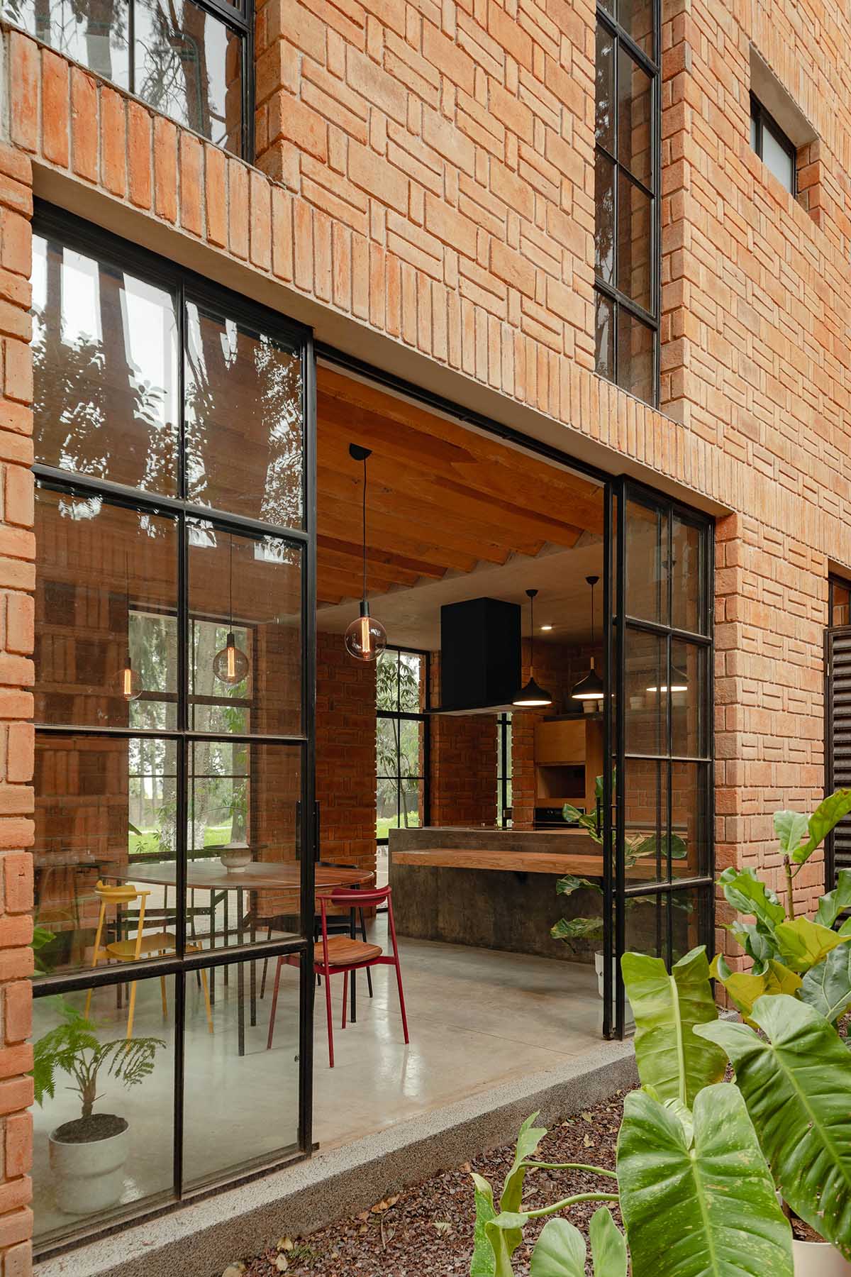 Estudio Tecalli uses red clay brick, concrete and glass to form MoMa House in Mexico