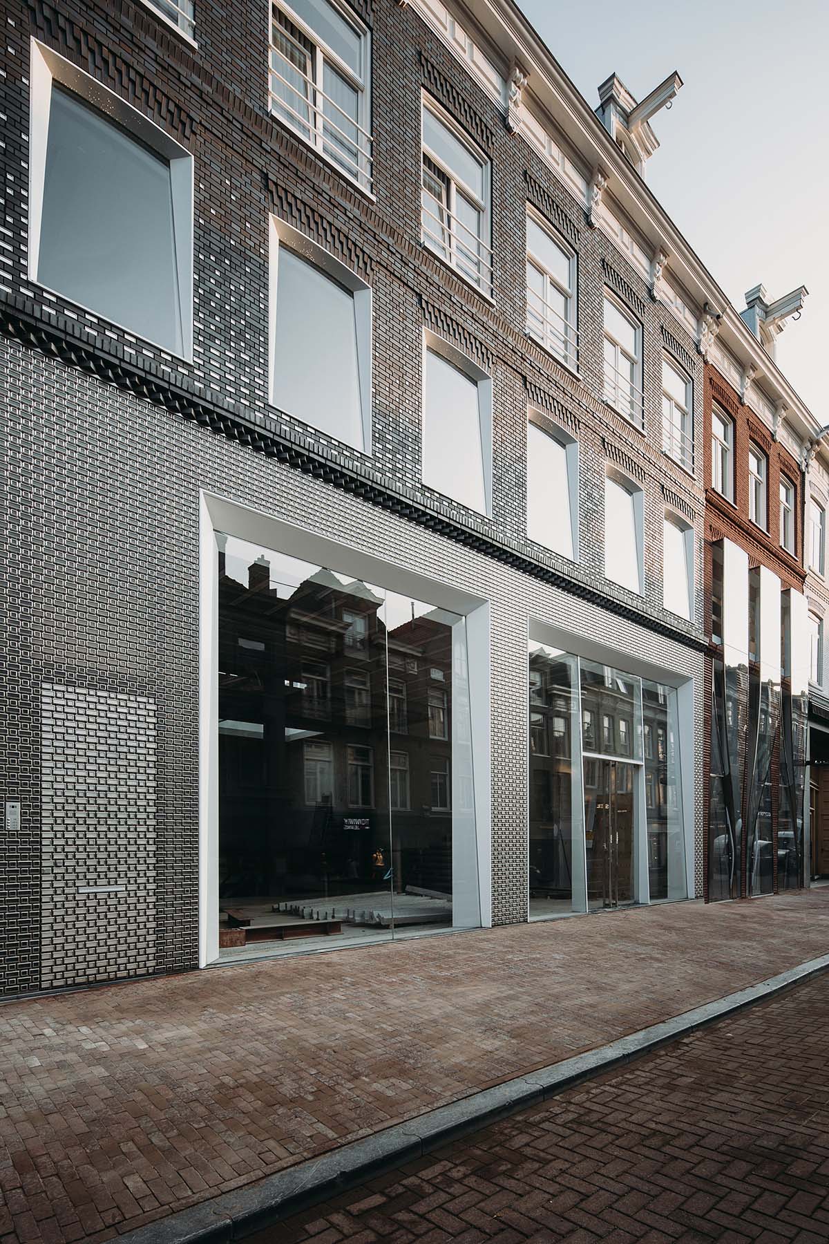 UNStudio creates brick textured facade for a retail store in Amsterdam