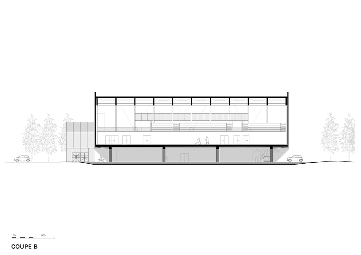 The gold-colored, folded facade gives a striking and symbolic presence to a new sports complex 