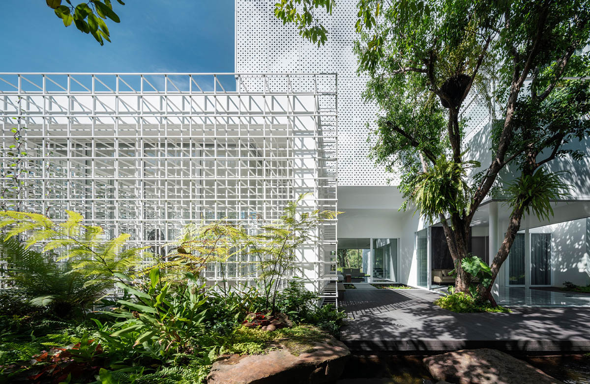 AAd built self-sustainable residence with perforated facade and steel rods in Thailand