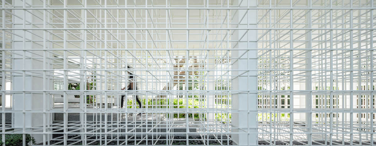 AAd built self-sustainable residence with perforated facade and steel rods in Thailand